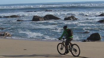 Riding the sand around Koura Point